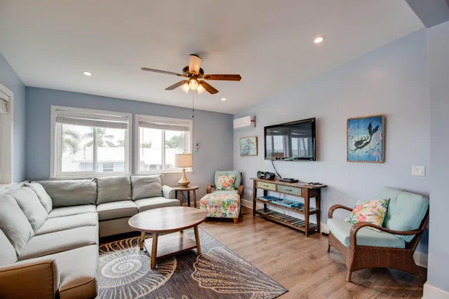 a kitchen with a sink stove top oven and refrigerator