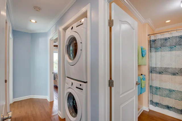 a bedroom with a bed dresser and a window