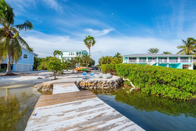a swimming pool with outdoor seating