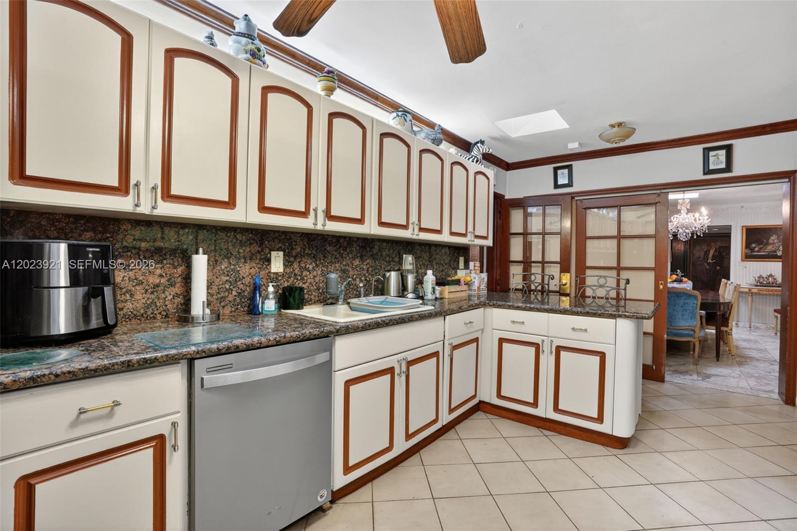 8461 Southwest 68th St Road Miami, FL 33143 - Photo 56 of 65 a kitchen with stainless steel appliances granite countertop a sink and cabinets