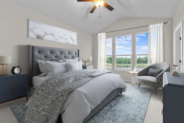 a bedroom with a bed and a large window