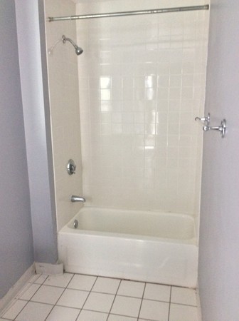 592 Trapelo Road Belmont, MA 02478 - Photo 14 of 23 a white bath tub sitting next to a shower