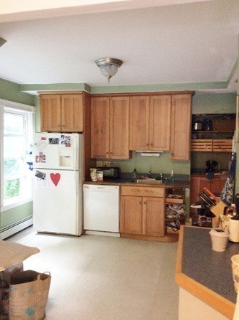 592 Trapelo Road Belmont, MA 02478 - Photo 5 of 23 a kitchen with a refrigerator a stove a sink and a window