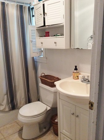 592 Trapelo Road Belmont, MA 02478 - Photo 7 of 23 a bathroom with a sink a toilet and a mirror