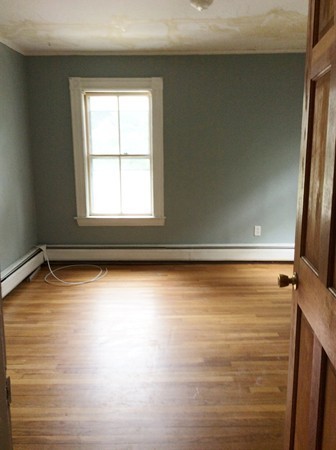 592 Trapelo Road Belmont, MA 02478 - Photo 10 of 23 a view of a room with wooden floor and a window