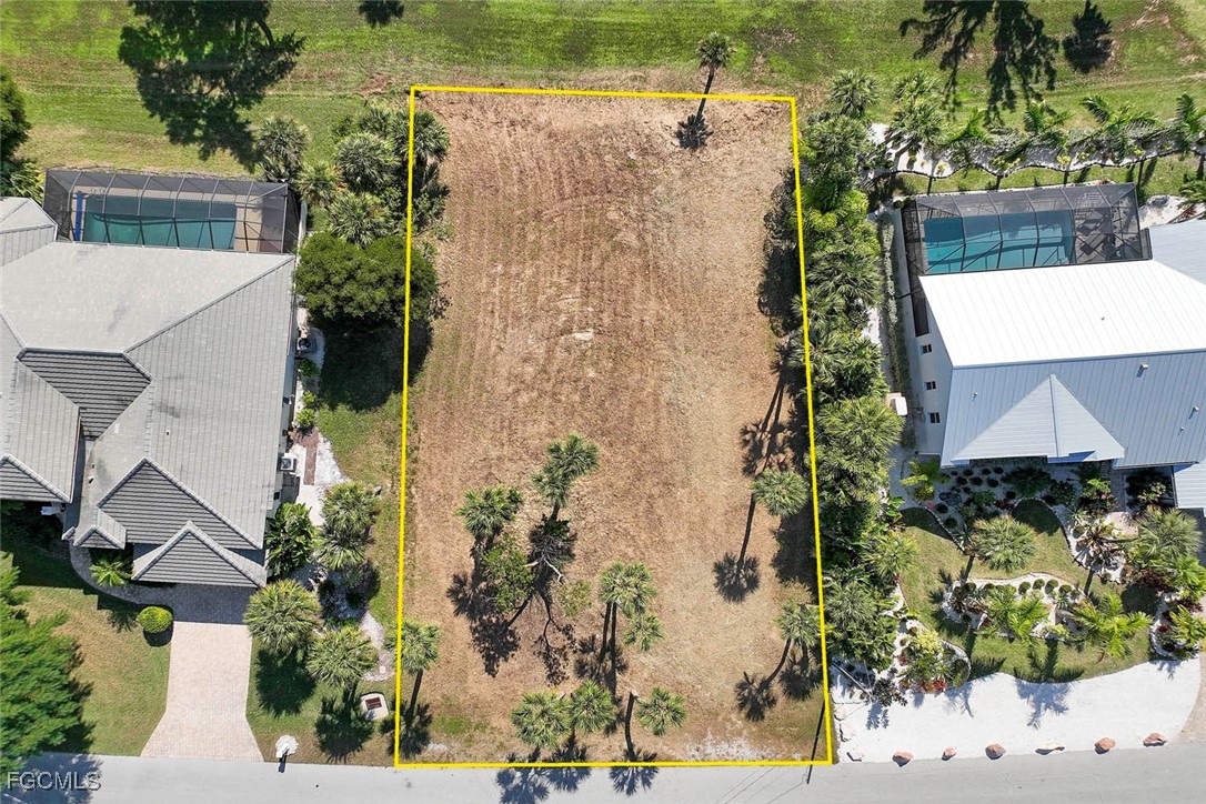 1292 Par View Drive Sanibel, FL 33957 - Photo 2 of 18 a aerial view of a house with a yard and large trees