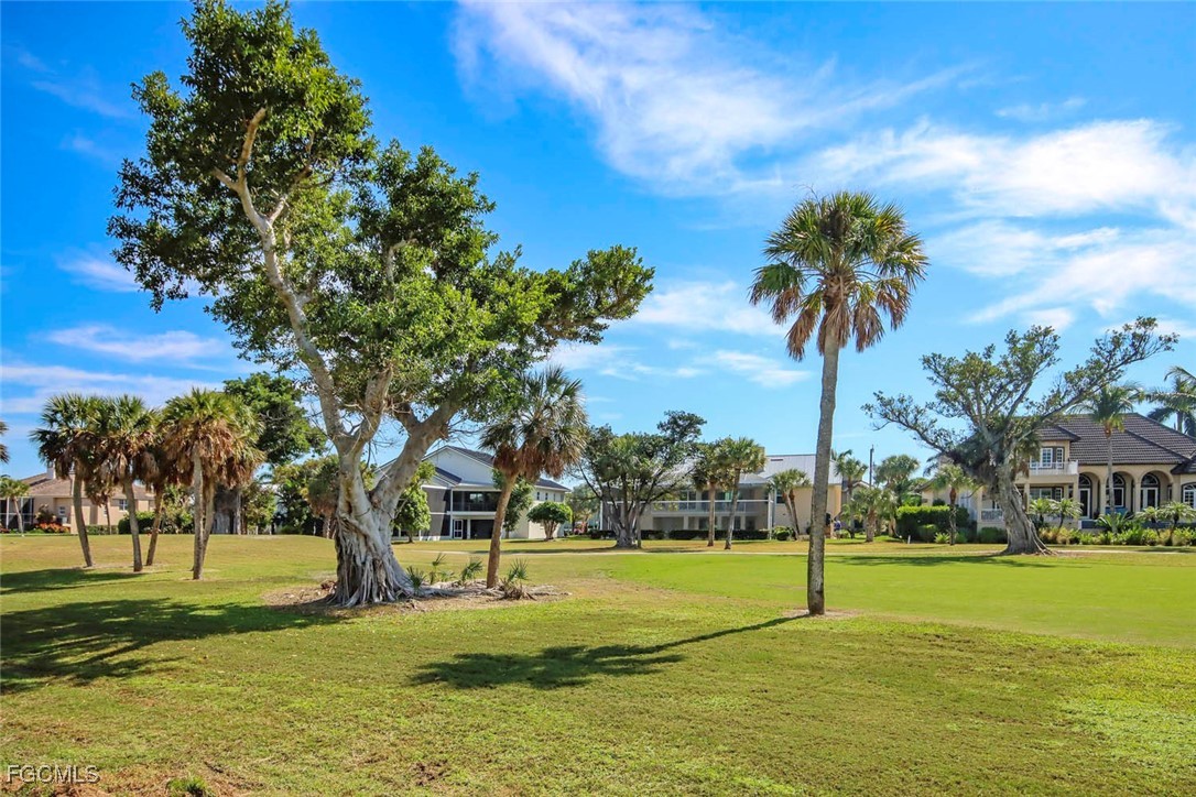 1292 Par View Drive Sanibel, FL 33957 - Photo 10 of 18 a view of a fountain in front of a house with a big yard
