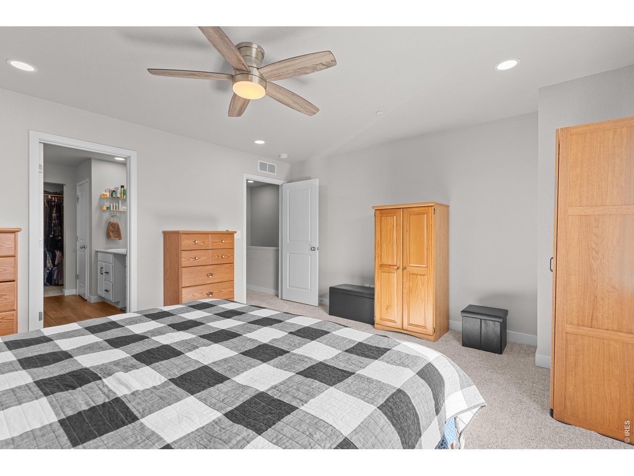 6611 4th Street, Unit 1 Greeley, CO 80634 - Photo 30 of 48 Roomy primary bedroom with ceiling fan.