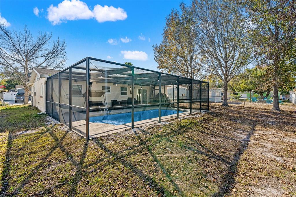 8025 Durham Drive Port Richey, FL 34668 - Photo 14 of 30 a view of a house with yard and trees
