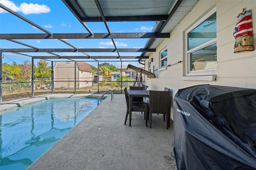 8025 Durham Drive Port Richey, FL 34668 - Photo 20 of 30 a kitchen with a sink and wooden cabinets