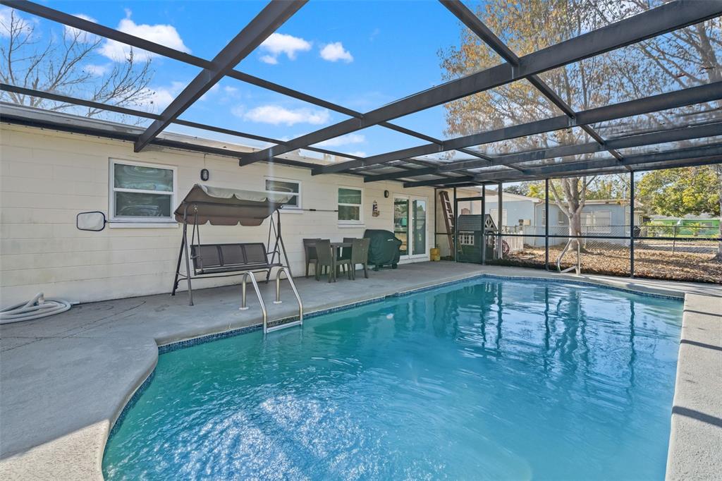 8025 Durham Drive Port Richey, FL 34668 - Photo 2 of 30 a view of a porch with furniture and a yard