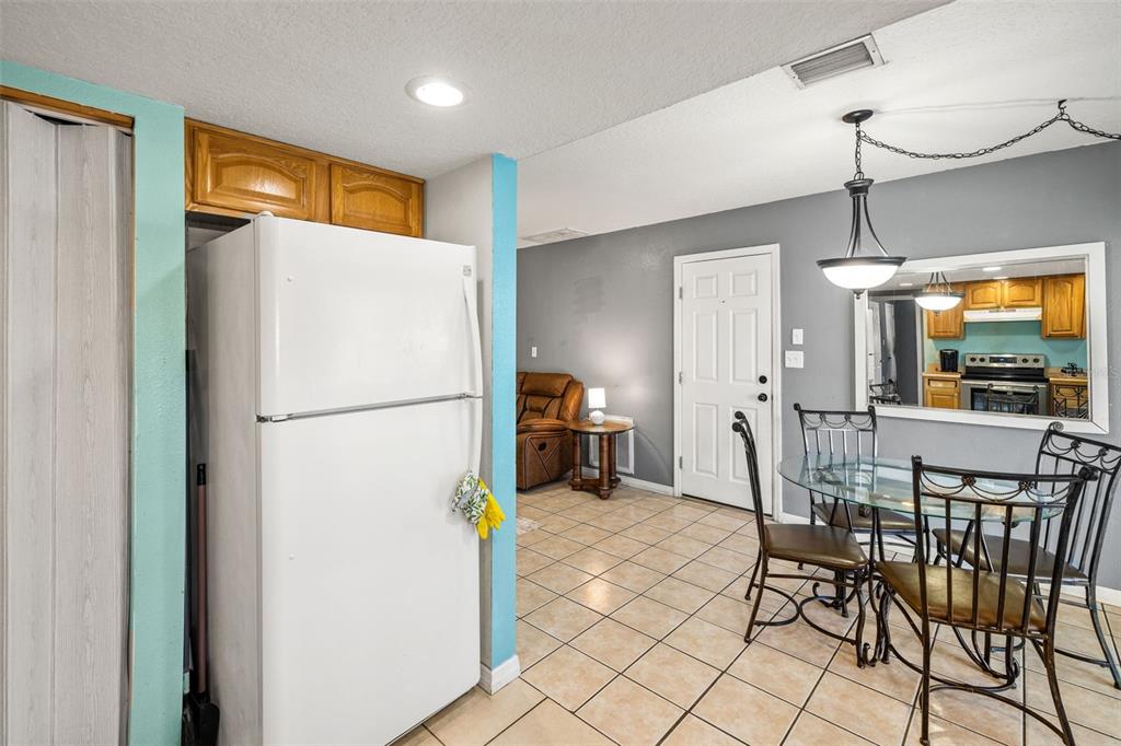 8025 Durham Drive Port Richey, FL 34668 - Photo 25 of 30 a refrigerator freezer sitting in a kitchen with a refrigerator