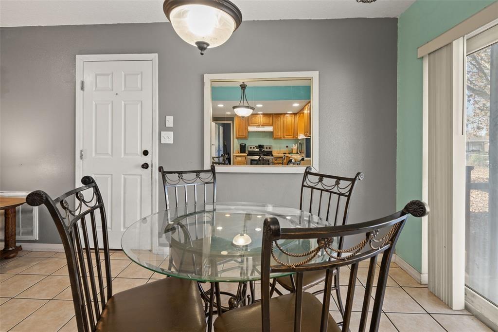 8025 Durham Drive Port Richey, FL 34668 - Photo 6 of 30 a view of a dining room with furniture and window