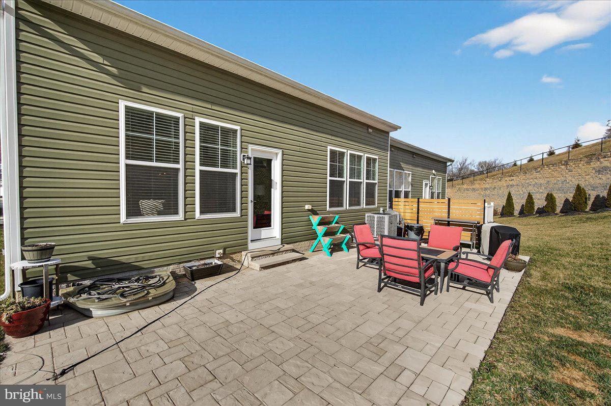 2896 Town View Circle New Windsor, MD 21776 - Photo 11 of 45 a backyard of a house with seating space