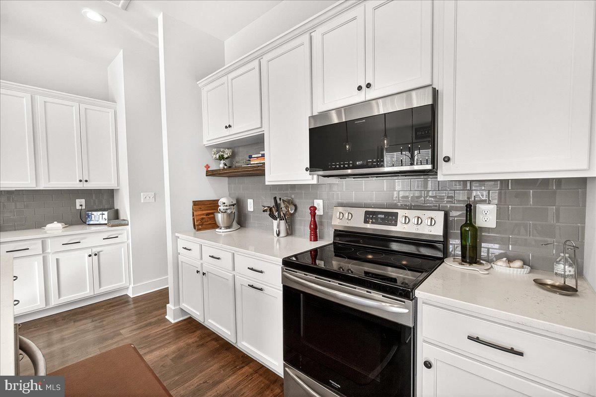 2896 Town View Circle New Windsor, MD 21776 - Photo 18 of 45 a kitchen with cabinets stainless steel appliances and a sink