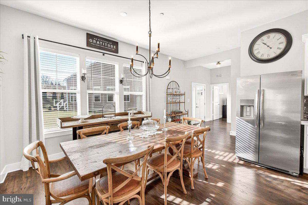 2896 Town View Circle New Windsor, MD 21776 - Photo 23 of 45 a view of a dining room with furniture window and wooden floor