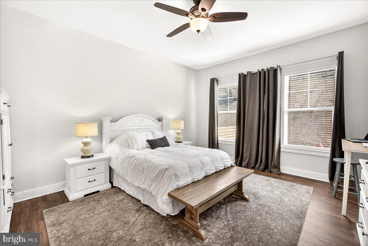 2896 Town View Circle New Windsor, MD 21776 - Photo 28 of 45 a bedroom with a bed and a chandelier