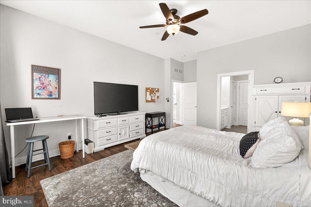 2896 Town View Circle New Windsor, MD 21776 - Photo 29 of 45 a bedroom with a bed and a flat screen tv