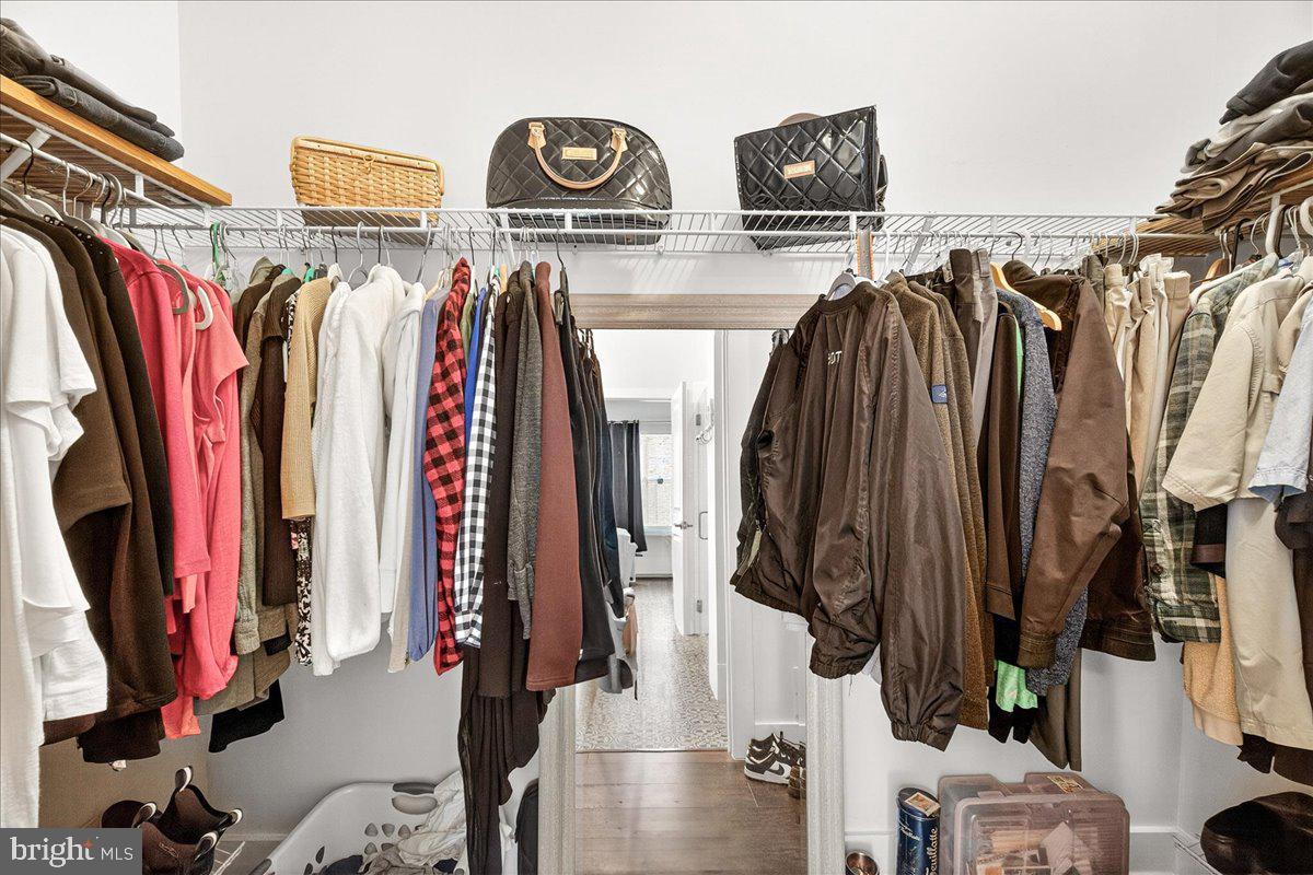 2896 Town View Circle New Windsor, MD 21776 - Photo 32 of 45 a view of walk in closet with clothes and shoes