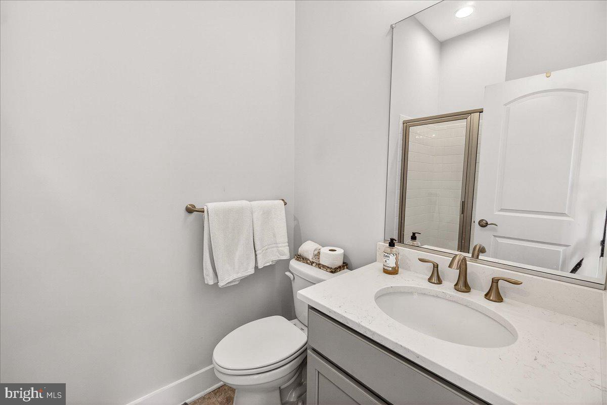 2896 Town View Circle New Windsor, MD 21776 - Photo 33 of 45 a bathroom with a sink toilet and mirror