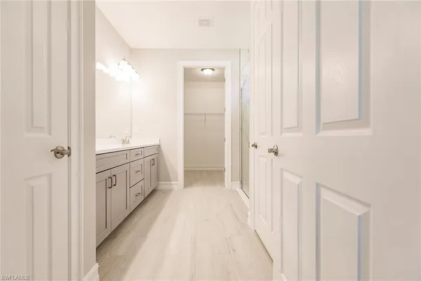 a bathroom with a double vanity sink and mirror