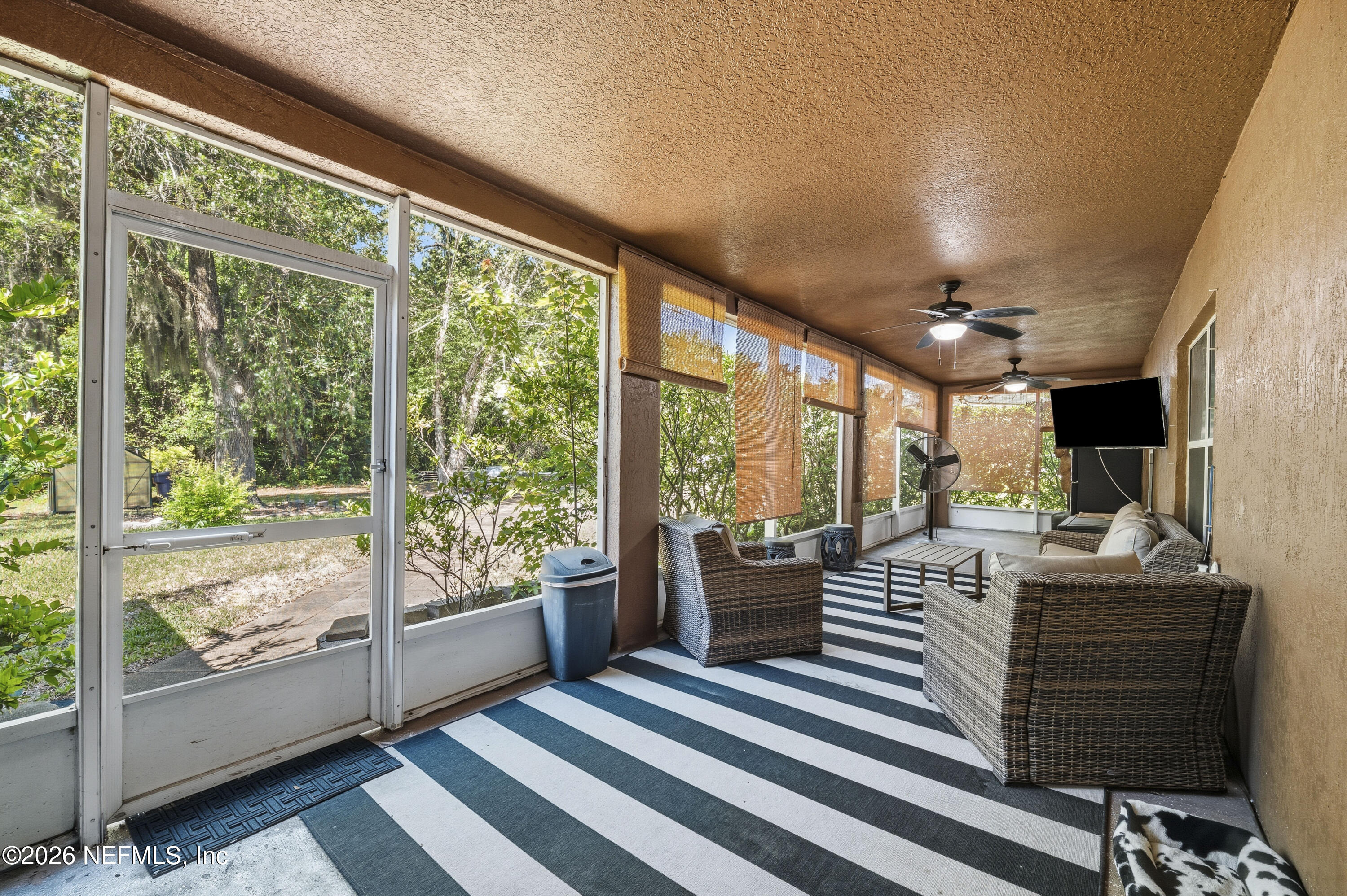 97106 Yorkshire Drive Yulee, FL 32097 - Photo 6 of 53 05 Screened-In Lanai