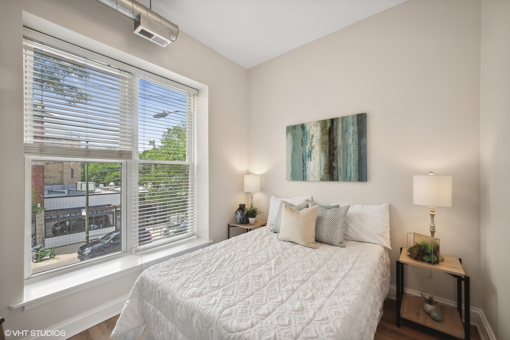1245 West George Street, Unit 203 Chicago, IL 60657 - Photo 12 of 15 a bedroom with a large bed and a window