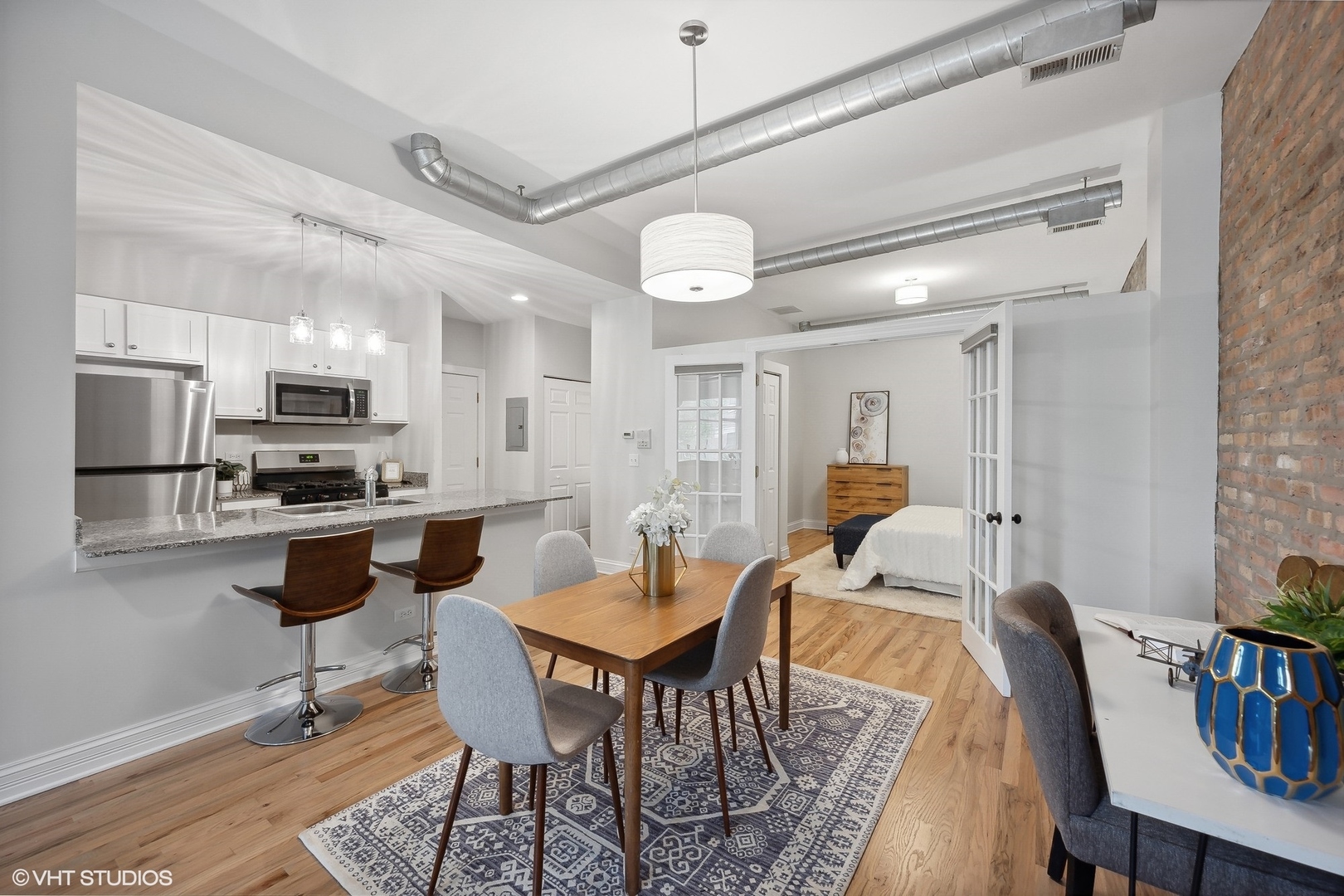1245 West George Street, Unit 203 Chicago, IL 60657 - Photo 5 of 15 a view of a dining room with furniture