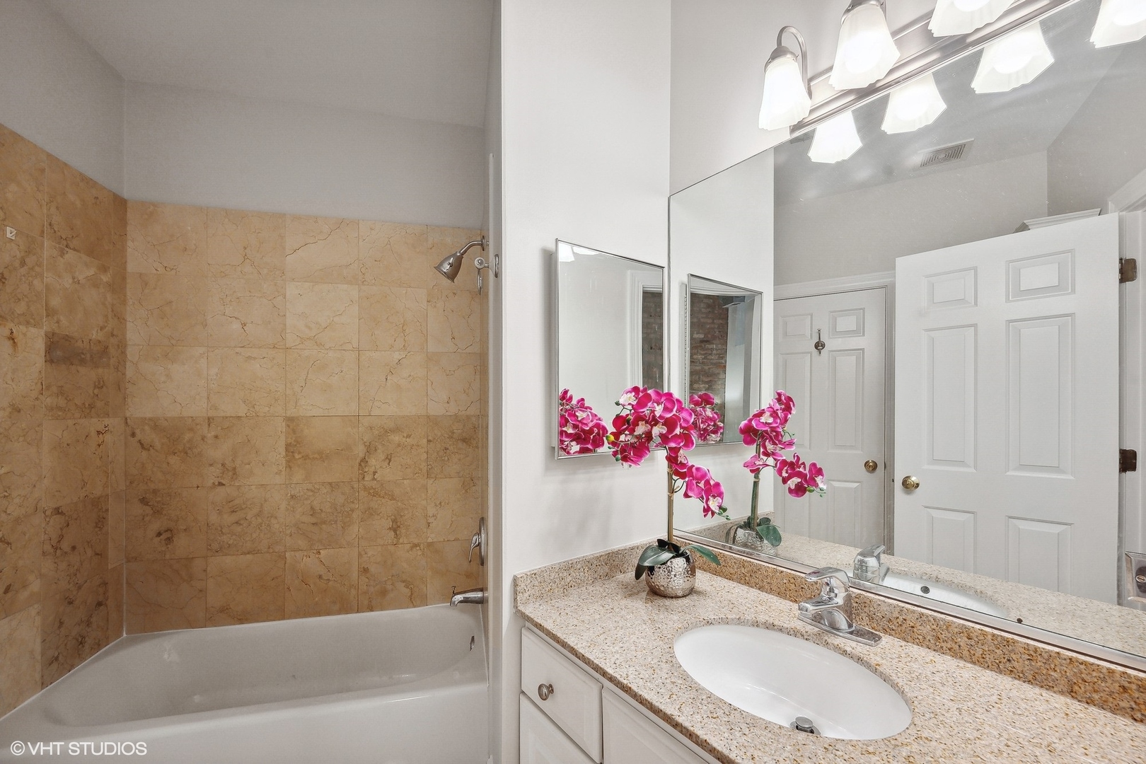 1245 West George Street, Unit 203 Chicago, IL 60657 - Photo 10 of 15 a bathroom with a granite countertop shower sink vanity granite and mirror