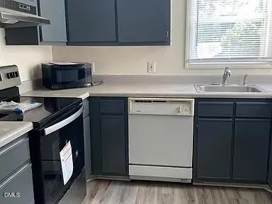 a kitchen with stainless steel appliances granite countertop a stove and a refrigerator