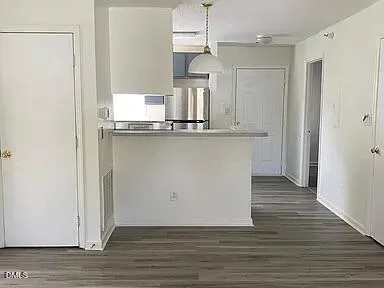 a kitchen with stainless steel appliances a refrigerator and a sink