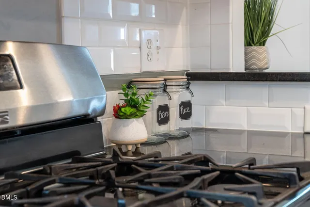 a view of a house with backyard and wooden fence