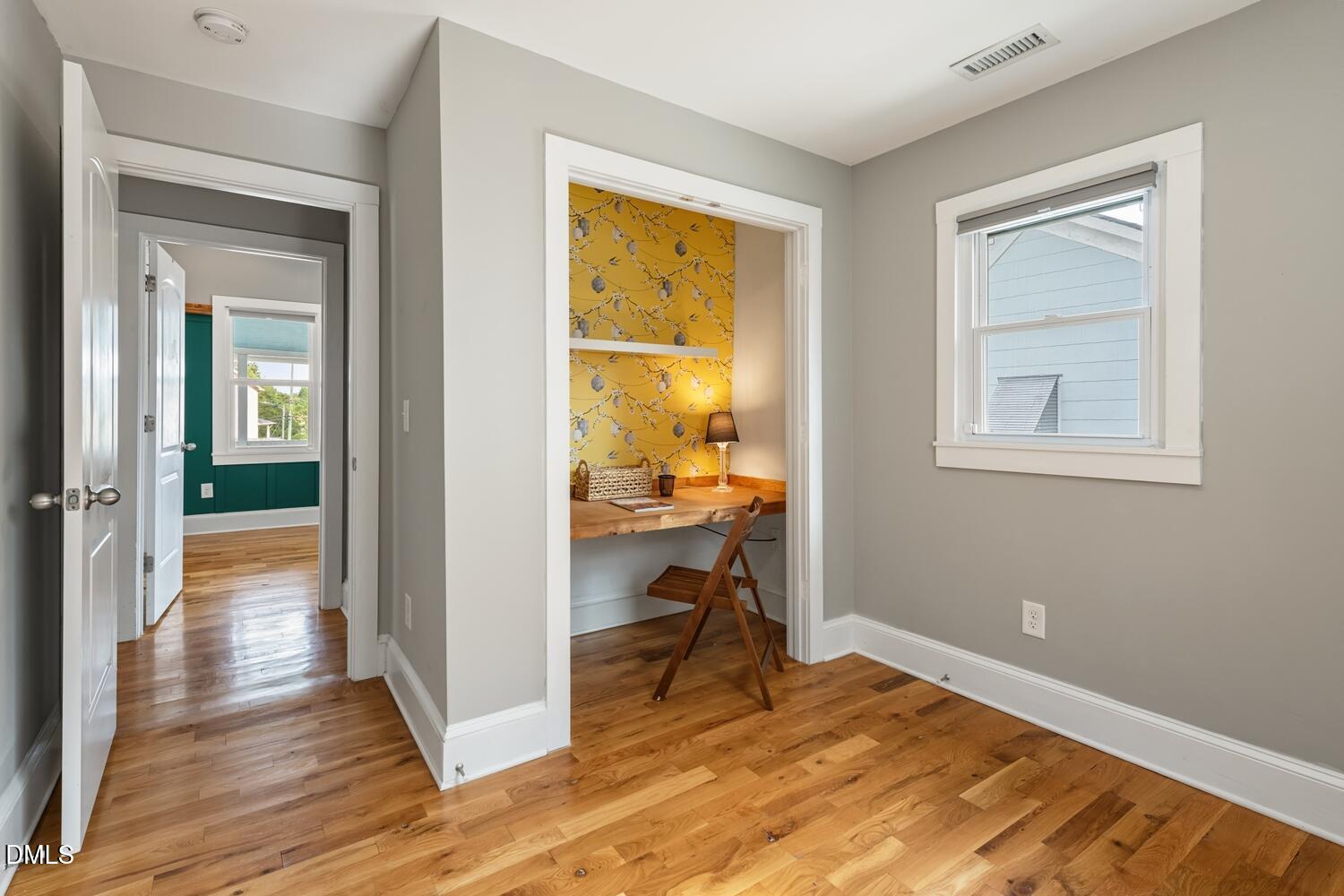 410 Bledsoe Avenue Raleigh, NC 27601 - Photo 19 of 37 a view of a bedroom with wooden floor and a bedroom