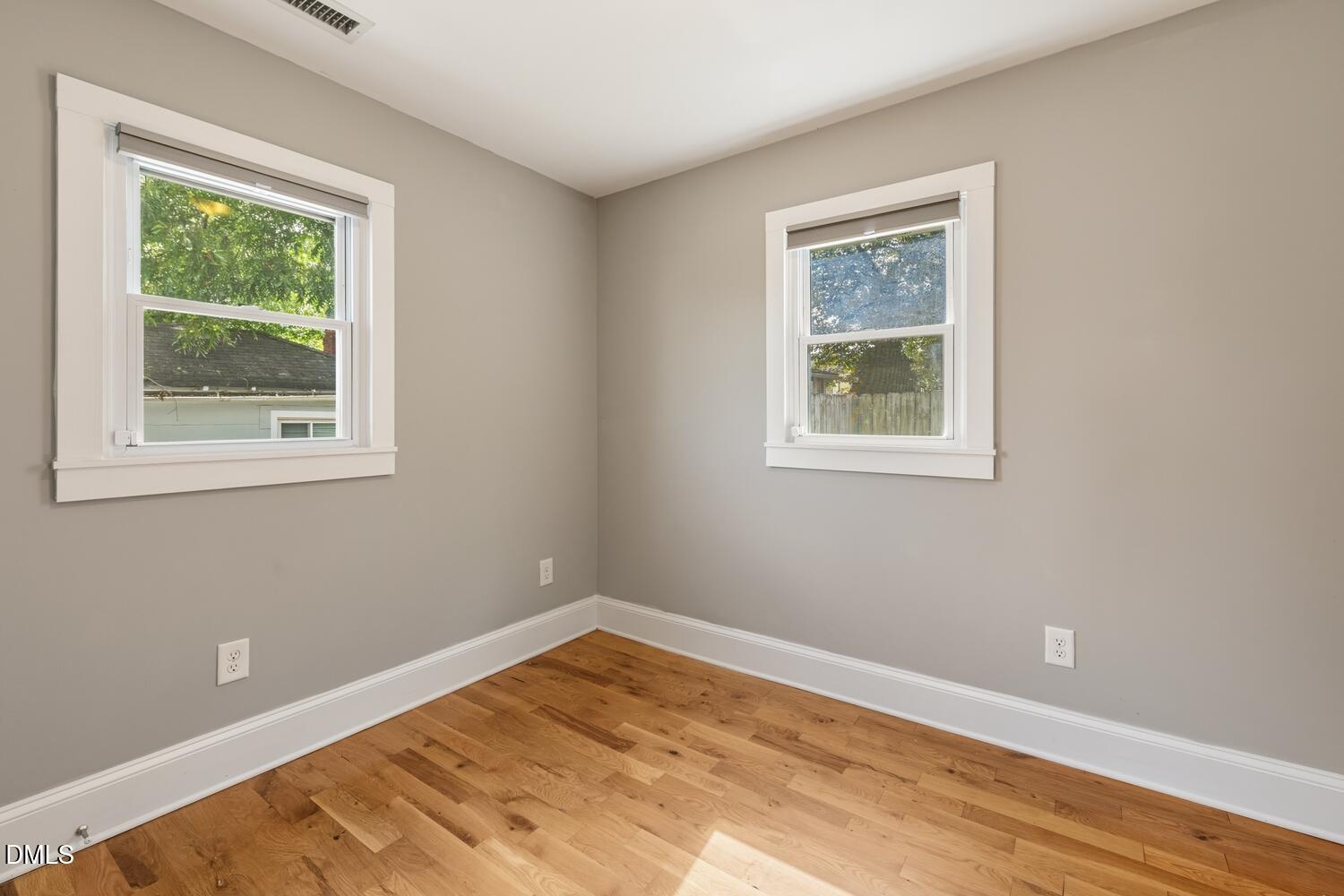 410 Bledsoe Avenue Raleigh, NC 27601 - Photo 21 of 37 a view of an empty room with wooden floor and a window
