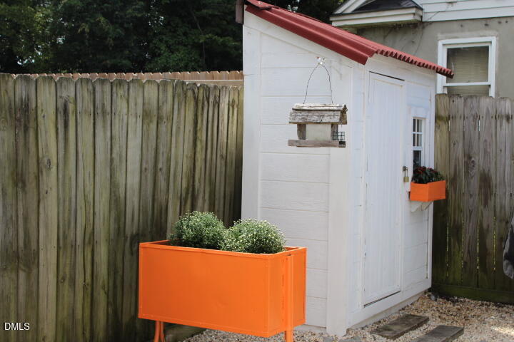 410 Bledsoe Avenue Raleigh, NC 27601 - Photo 24 of 37 a view of a house with backyard and wooden fence