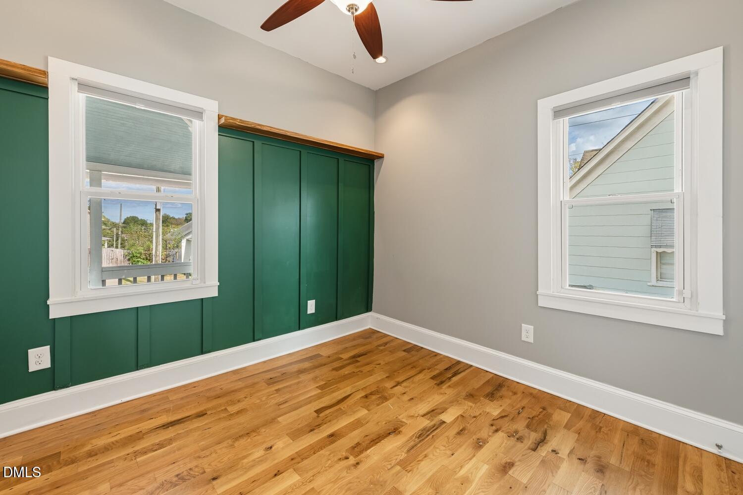 410 Bledsoe Avenue Raleigh, NC 27601 - Photo 7 of 37 an empty room with window and wooden floor