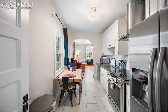a view of a kitchen and dining room