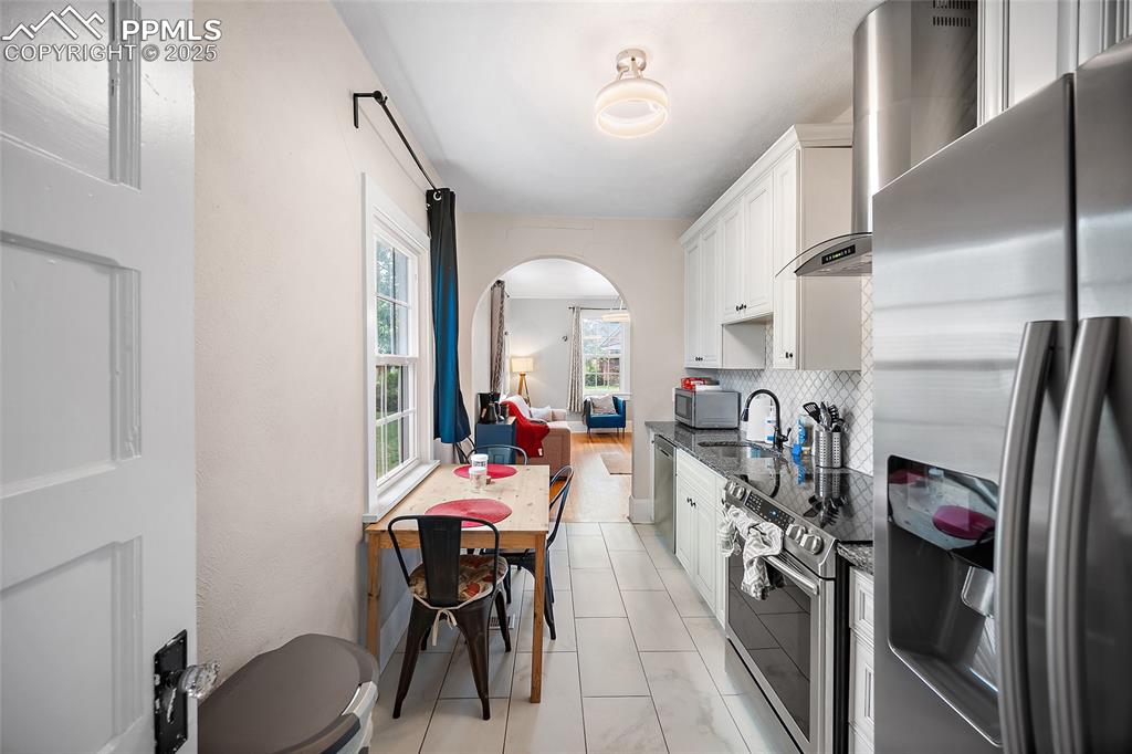 225 Custer Avenue Colorado Springs, CO 80903 - Photo 13 of 39 a view of a kitchen and dining room