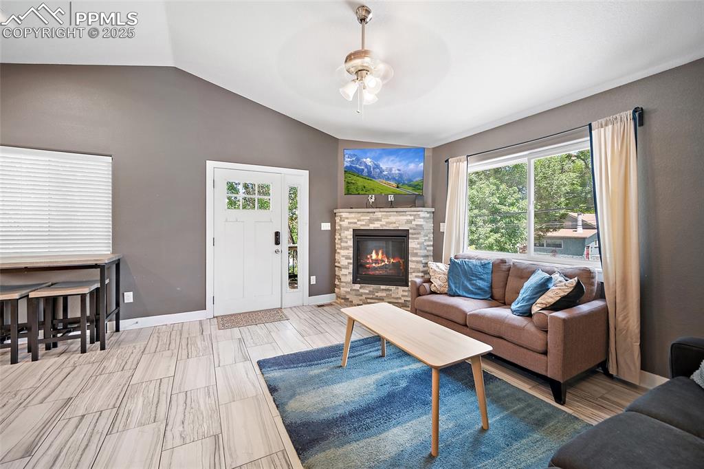 225 Custer Avenue Colorado Springs, CO 80903 - Photo 20 of 39 a living room with furniture and a fireplace