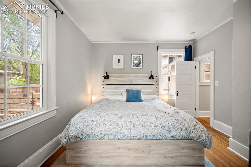 225 Custer Avenue Colorado Springs, CO 80903 - Photo 7 of 39 a bedroom with a large bed and a window