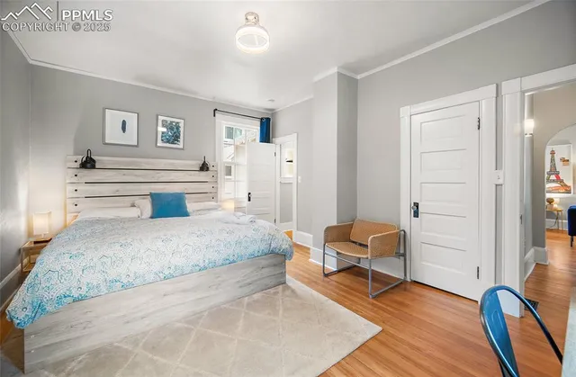 a spacious bedroom with a bed and furniture