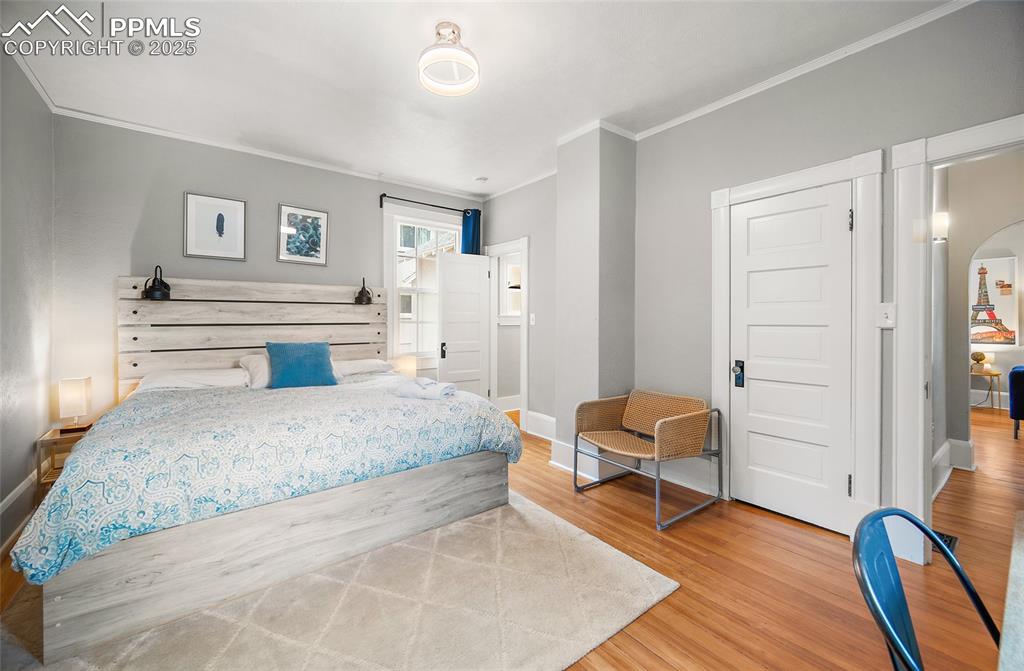 225 Custer Avenue Colorado Springs, CO 80903 - Photo 8 of 39 a spacious bedroom with a bed and furniture