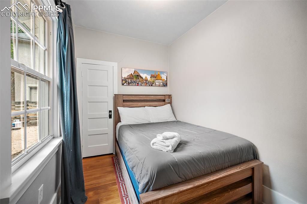 225 Custer Avenue Colorado Springs, CO 80903 - Photo 10 of 39 a bedroom with a bed and a window with outer view