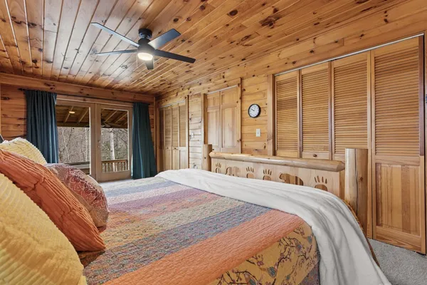 a bedroom with a large bed and a large window