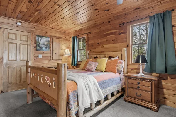 a bed room with a bed and a window