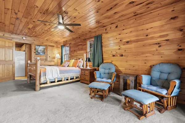 a bedroom with furniture and a chandelier