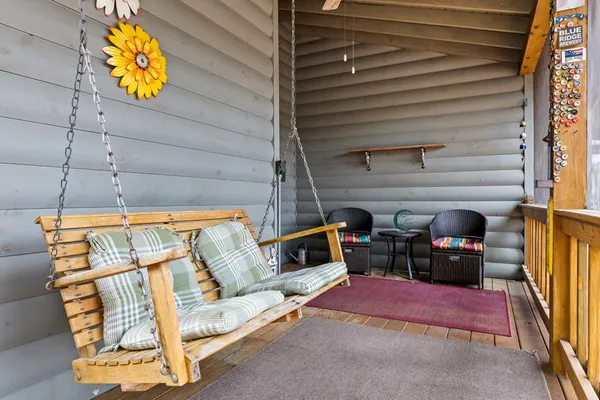 a view of jacuzzi with large trees and city view