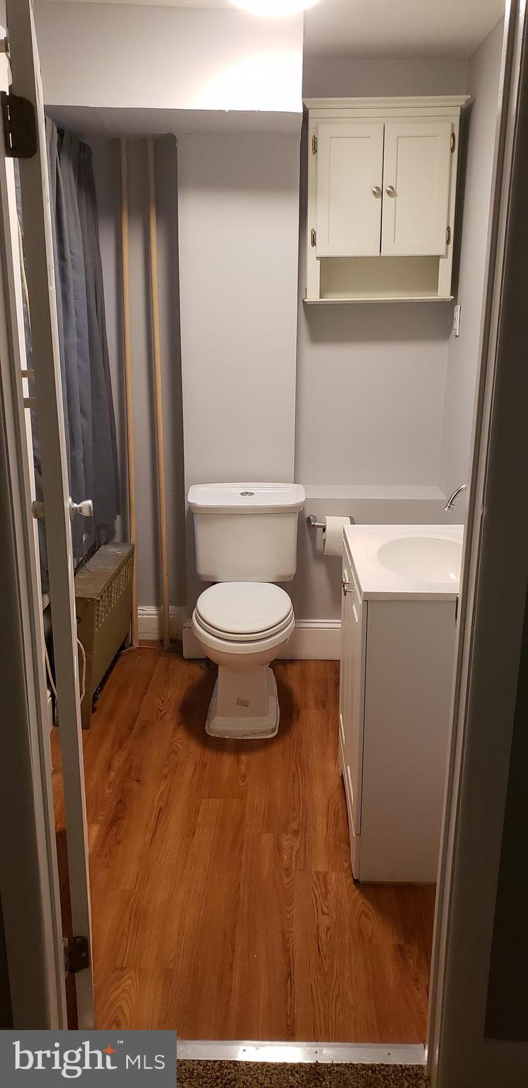4329 Main Street, Unit 2 Philadelphia, PA 19127 - Photo 5 of 5 a bathroom with a sink and a mirror