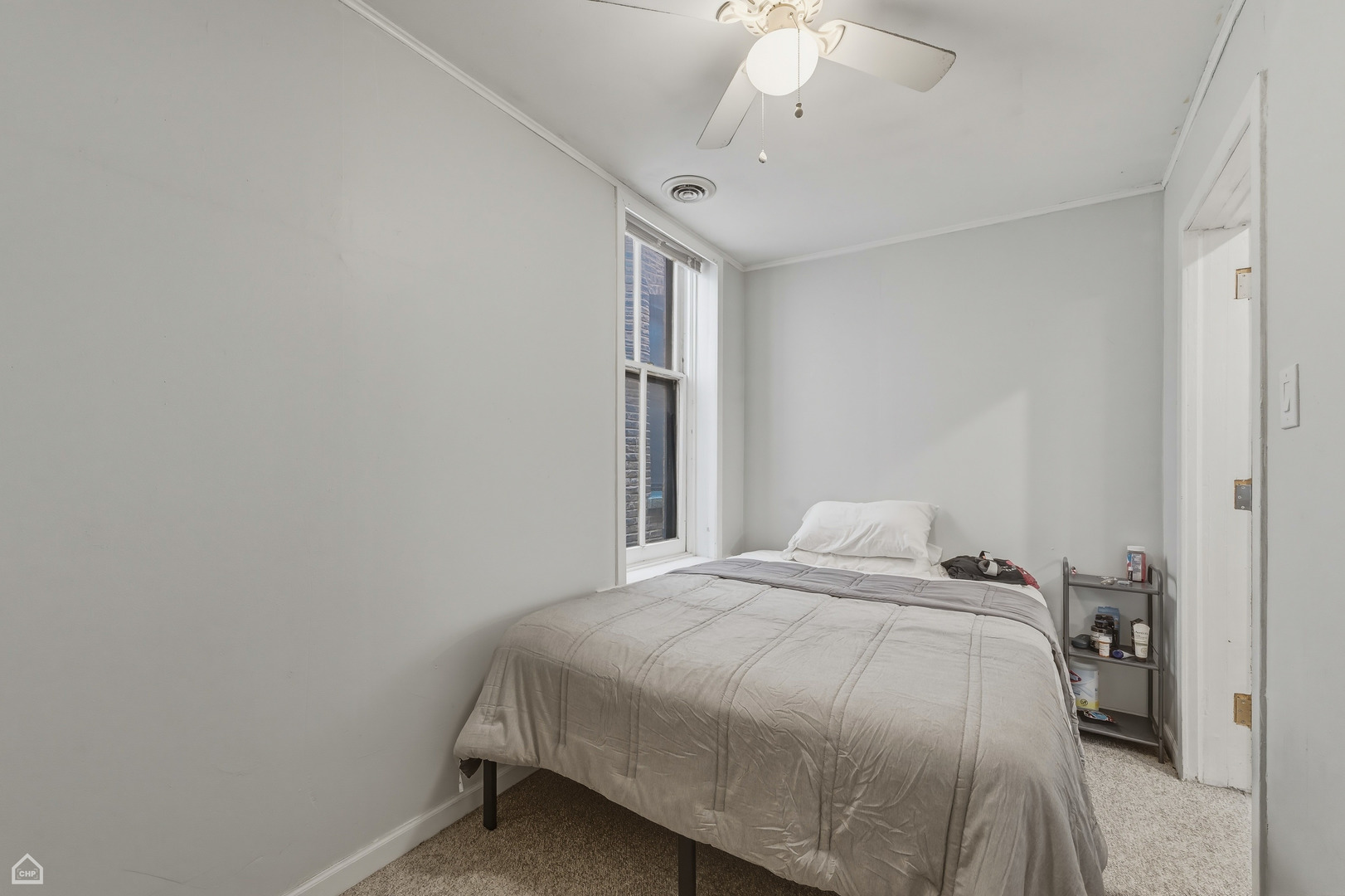 822 North Wood Street Chicago, IL 60622 - Photo 11 of 28 a bedroom with a bed and a chandelier