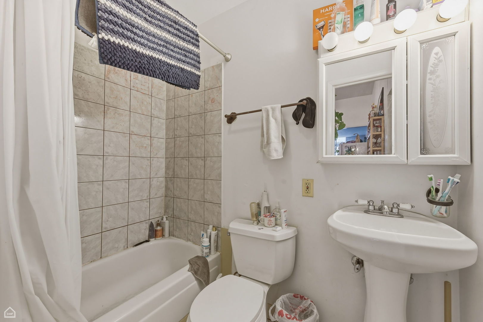 822 North Wood Street Chicago, IL 60622 - Photo 26 of 28 a bathroom with a sink and mirror with toilet